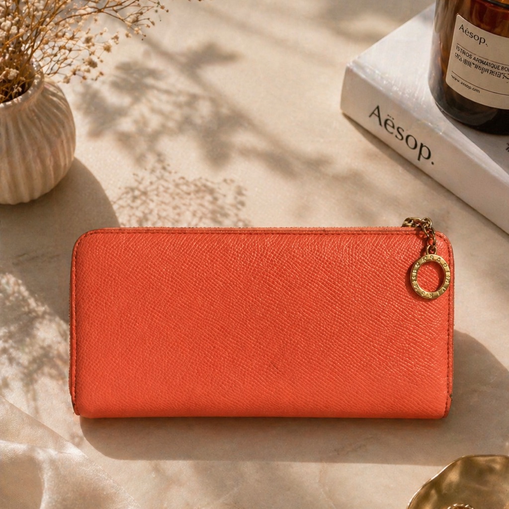 Bvlgari Orange Leather Zip Wallet With Gold Charm